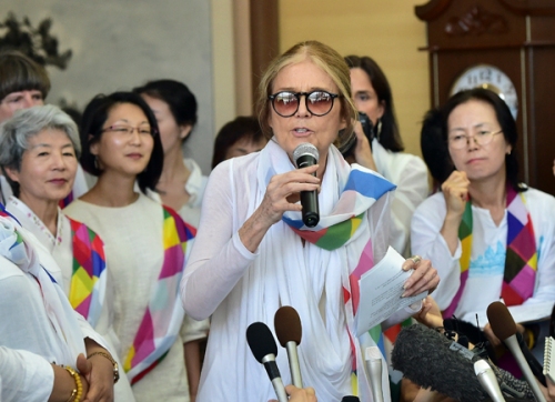 Feminist Gloria Steinem speaks to the media after her group of peace activists crossed the border line through the demilitarised zone (DMZ) separating the two Koreas on Sunday.
